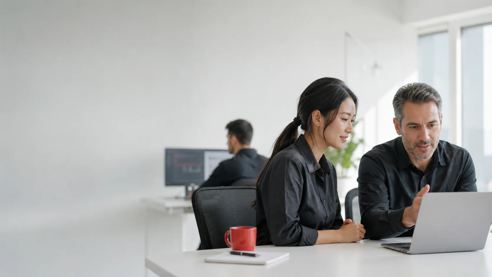IT specialists collaborating in a bright modern office